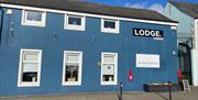 Blue painted traditional building housing Quarter House Coffee in Carrickfergus