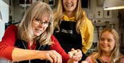 Group watching the instructor making jewellery as part of the jewellery making workshop with Gobbins Crafts in Islandmagee