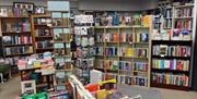 Shelves, stands and tables with books and cards