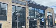 Black and stone coloured exterior of The Tower Shopping Centre in Ballymena