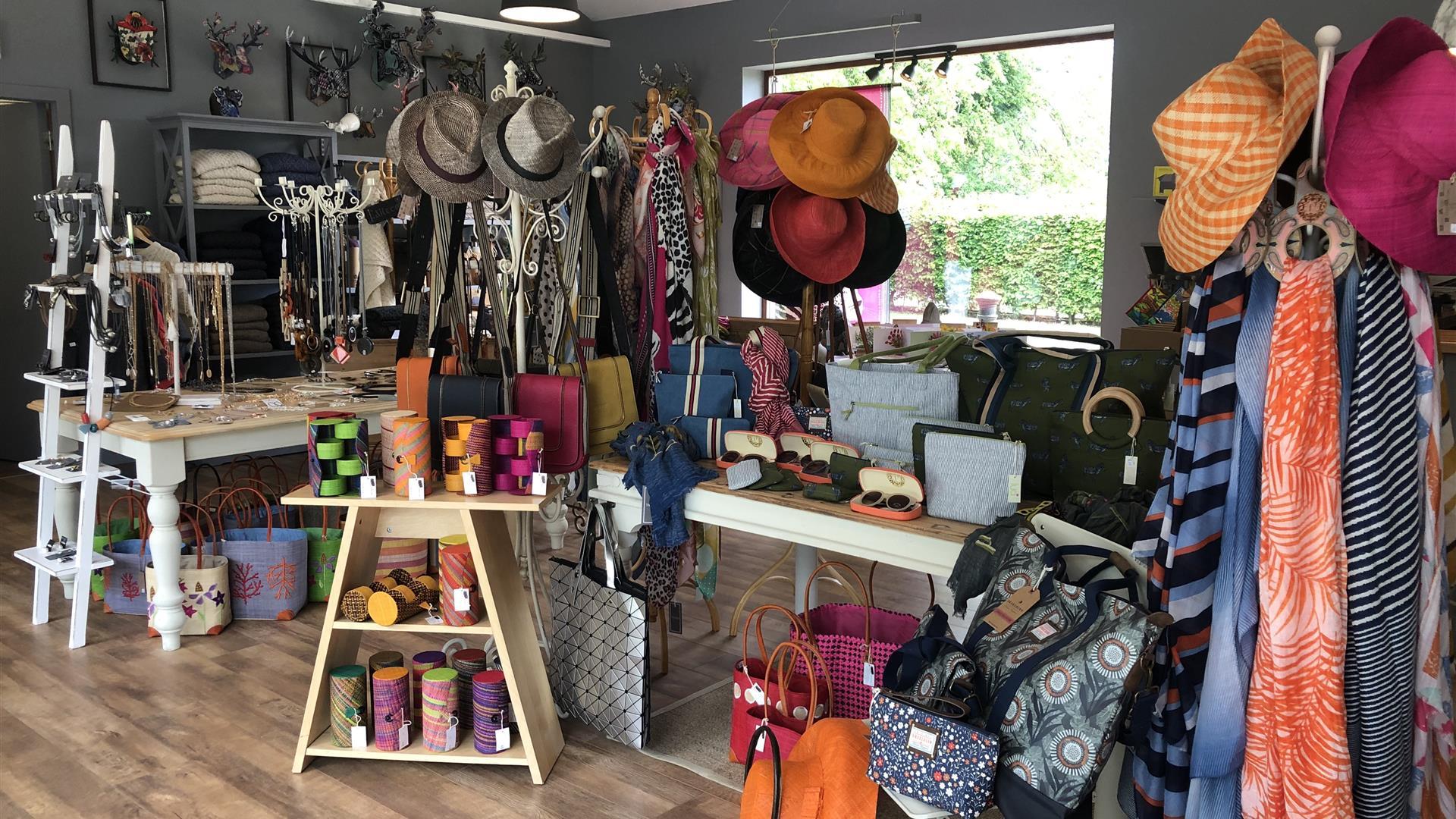 Shop with displays of hats, scarves, jewellery, handbags and more