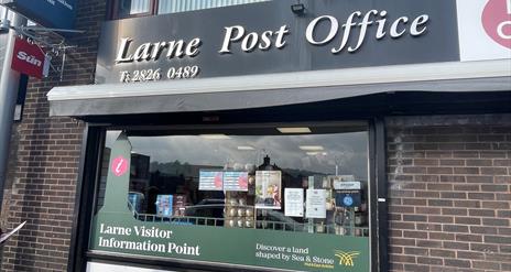 Exterior of the Book Nook in Larne with signage to promote Larne Post Office, Larne Visitor Information Point and MoneyGram