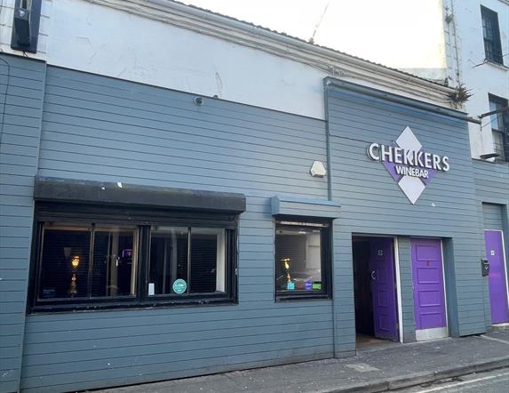 Purple and grey exterior of Chekkers Wine Bar