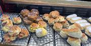 Variety of different scones displayed in a counter