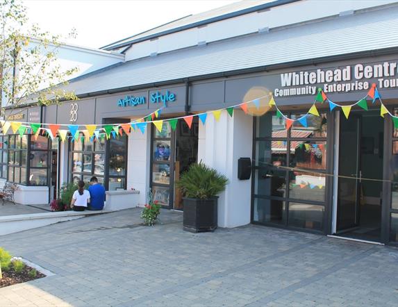 Photograph of Whitehead Centre on opening day. Coloured bunting is across the front of the building.
