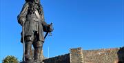 Stature of King William positioned in sight of Carrickfergus Castle wall