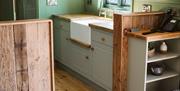 Kitchen area of the Shepherds Hut, complete with Belfast sink.