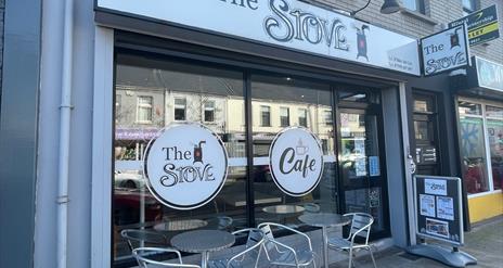 Exterior of The Stove in Larne with seats outside