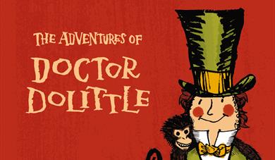 Doctor Dolittle in top hat surrounded with animals.