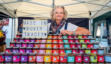Clare from Clare's Preserves smiles at the camera from her stand at Nourish Festival, Bovey Tracey