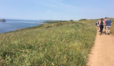 Photo of people walking the South West Coast Path at Wembury