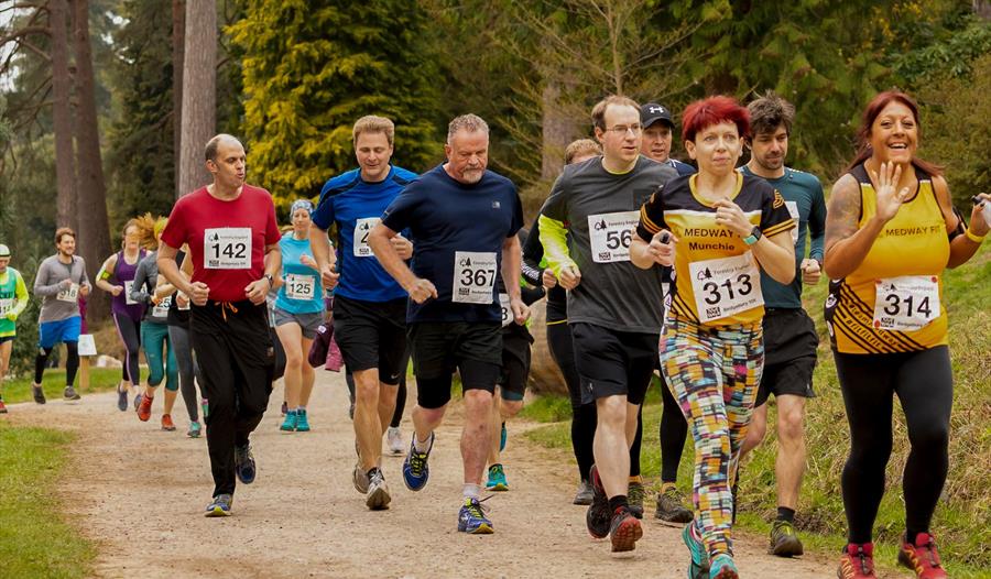 Runners smile at the camera