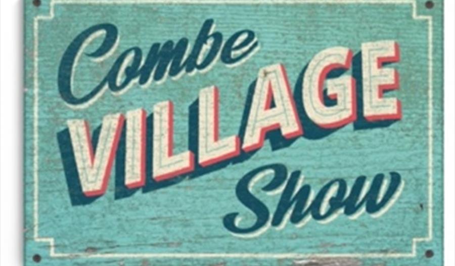 Combe Village Show logo on a turquoise painted background