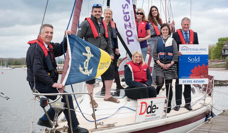 Sponsors for this year's River Exe Regatta gather at Topsham Sailing Club with its Commodore Peter Williams (far left)