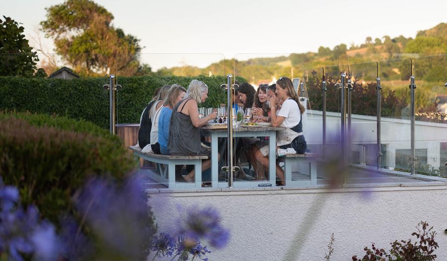 Guests enjoying dinner on the Seaflowers terrace