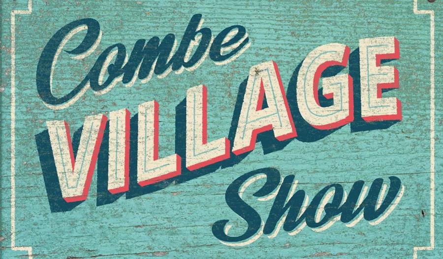Turqoise painted background with Combe Village Show written in script