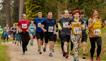 Runners smile at the camera