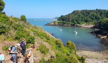 Walkers on the South West Coast Path between Paignton and Brixham