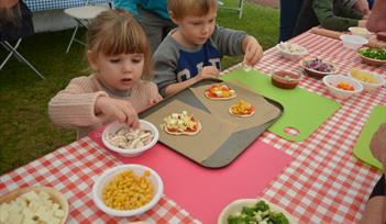 Children enjoy making their own lunch in the KidsZone