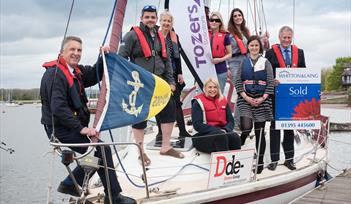 Sponsors for this year's River Exe Regatta gather at Topsham Sailing Club with its Commodore Peter Williams (far left)