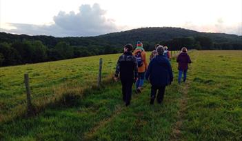 People taking part in a  guided farm walk