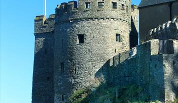 Photograph of Dartmouth Castle flying English Heritage flag