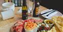 Mixed meat platter with drinks and blank ceramic items