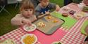 Children enjoy making their own lunch in the KidsZone