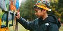 Child interacting with Gruffalo trail activity panel