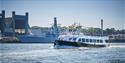 A passenger boat passing the Dockyard