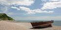 Boat left at Seaton Seafront