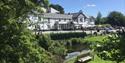 View of the hotel and front gardens on a sunny day