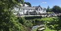 View of the hotel and front gardens on a sunny day