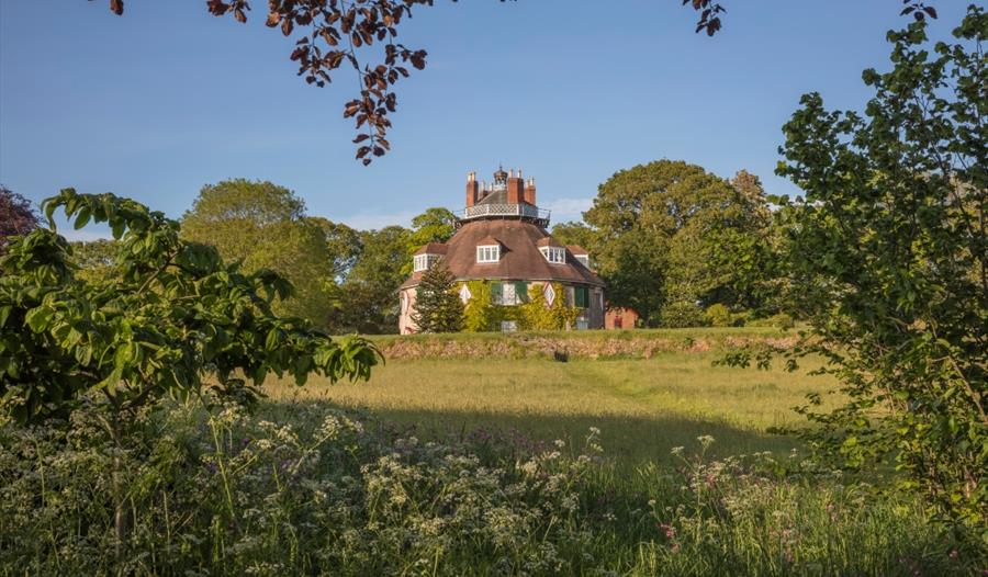The unusual 16-sided house at National Trust A la Ronde, sitting in golden wild meadow and with views to the Exe estuary beyond. The unusual 16-sided house at National Trust A la Ronde, sitting in golden wild meadow and with views to the Exe estuary beyond.