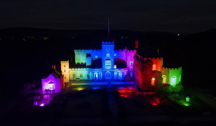 The Castle exterior lit up with colourful lights