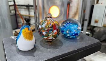 Glassmaking workshops at Teign Valley Glass - a glass bauble, bird and paperweight