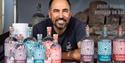 Owner of Papillon Gin smiles at the camera from his stand at Nourish Festival, Bovey Tracey.