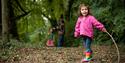 Child explores the woods at The Donkey Sanctuary
