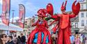 Street entertainers in sea creature costumes