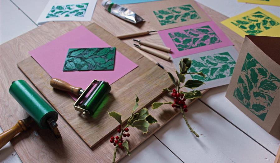 Lino cut images of holly