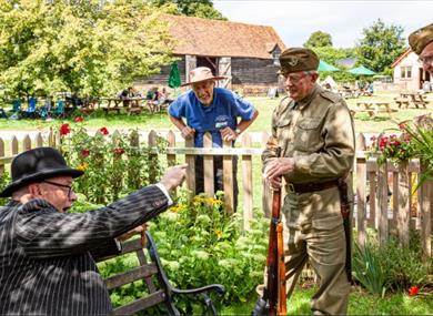 Churchill talking to WW2 reenactors and museum volunteer