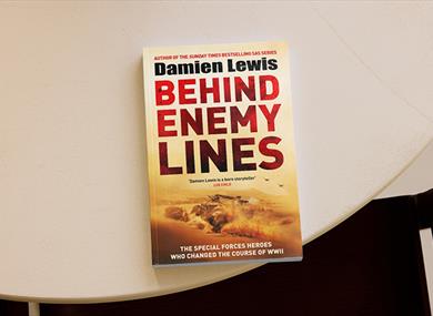 A copy of Damien Lewis' book on a table
