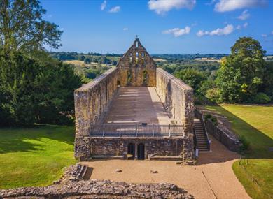 View of Battle Abbey in 1066 Country, with historic stone ruins overlooking the surrounding countryside.
