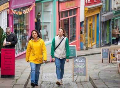 Friends exploring Folkestone High Street in Kent
