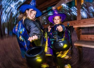 Two children trying out the new Halloween Potion trail at Go Ape Bedgebury