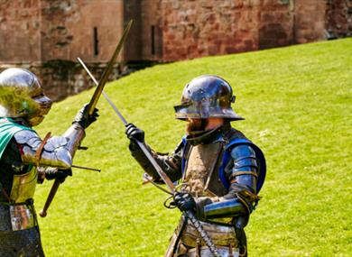 Two armoured knights fighting at Knights' Tournament at Carisbrooke Castle, history event, what's on, Isle of Wight