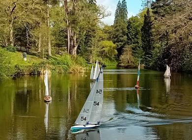 Model Boats on the Lake at Leonardslee Lakes and Gardens in West Sussex