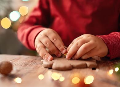 A child making a shape out of clay