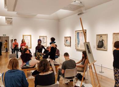 A group of happy participants in a Life Drawing session