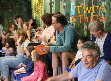 Children listening and watching storytelling at Roald Dahl Museum and Story Centre, Buckinghamshire